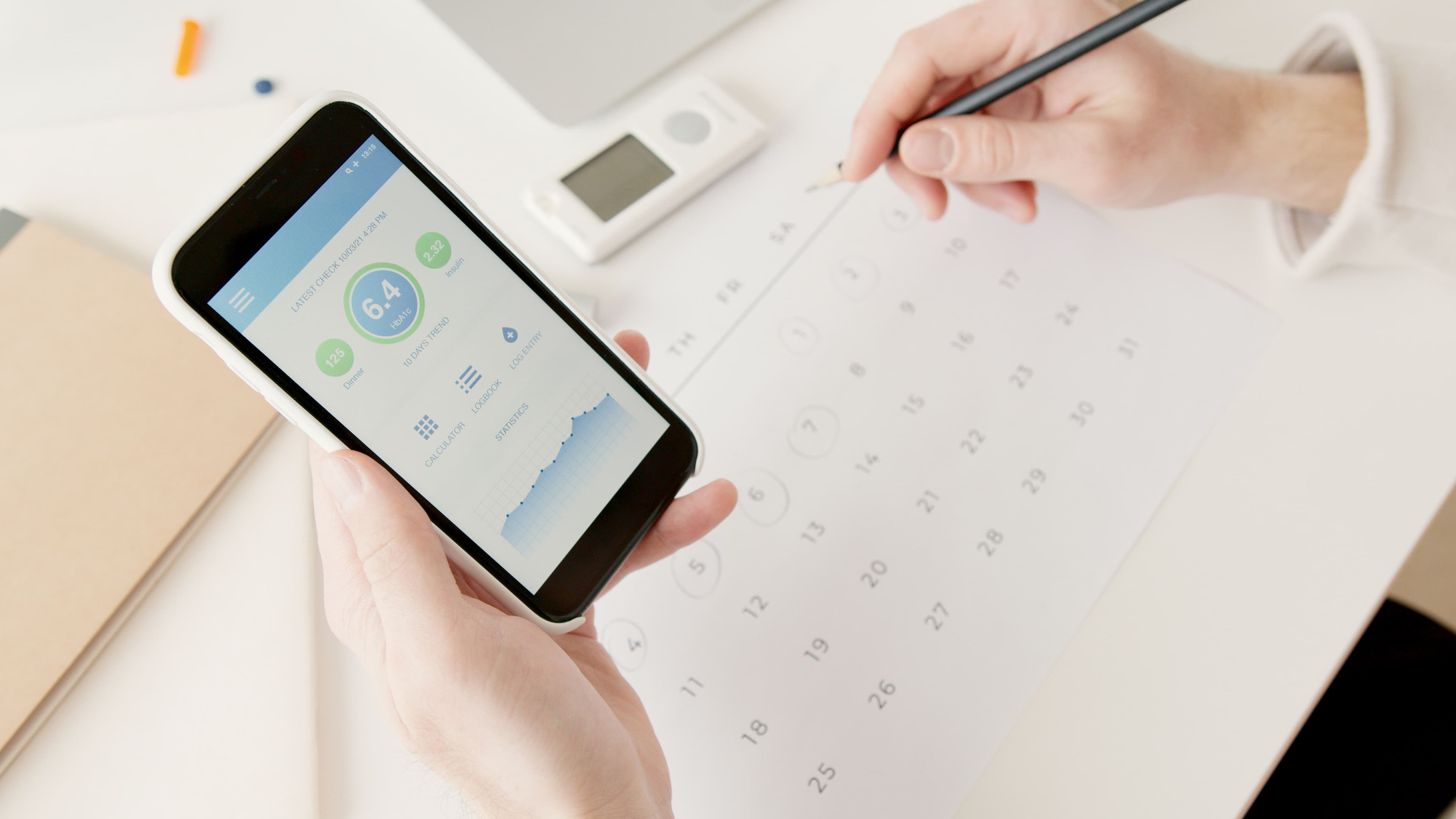 Patient reviewing remote glucose monitoring data on a mobile app
